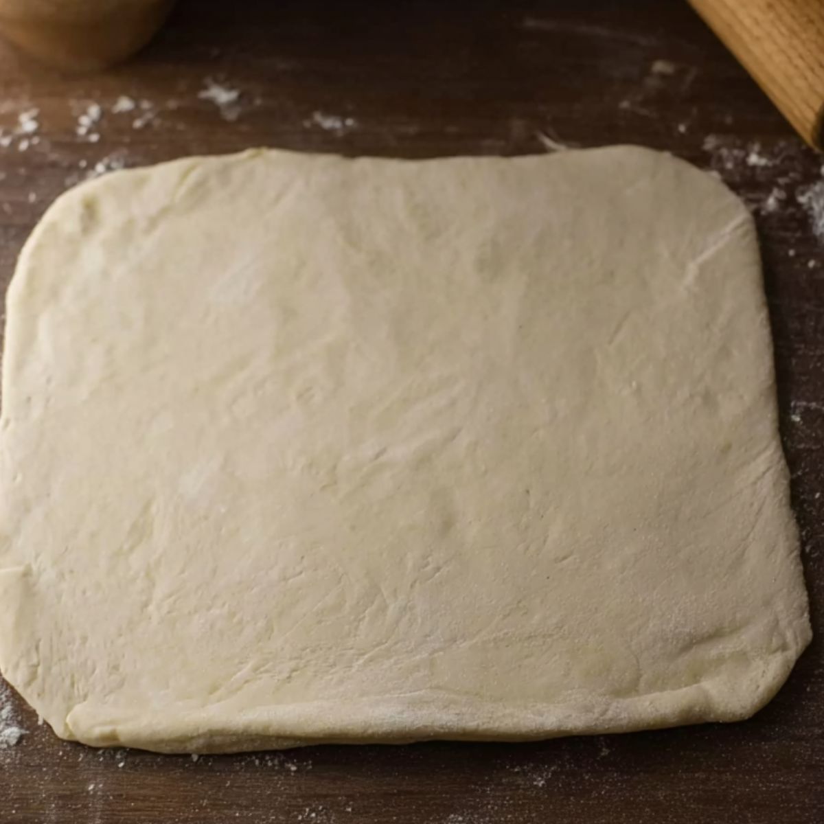 This image shows the dough beautifully rolled out on a floured surface, ready for the next step in preparing the homemade breakfast hot pocket. It’s smooth and even, offering the perfect foundation for filling and shaping.