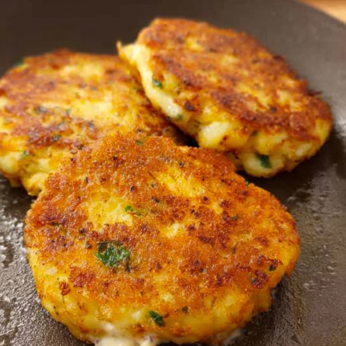 Golden, crispy potato patties sizzling in the pan, perfectly fried to a crunchy exterior and soft interior. Packed with flavor and herbs, these patties make an excellent side dish, snack, or filling for a savory sandwich.