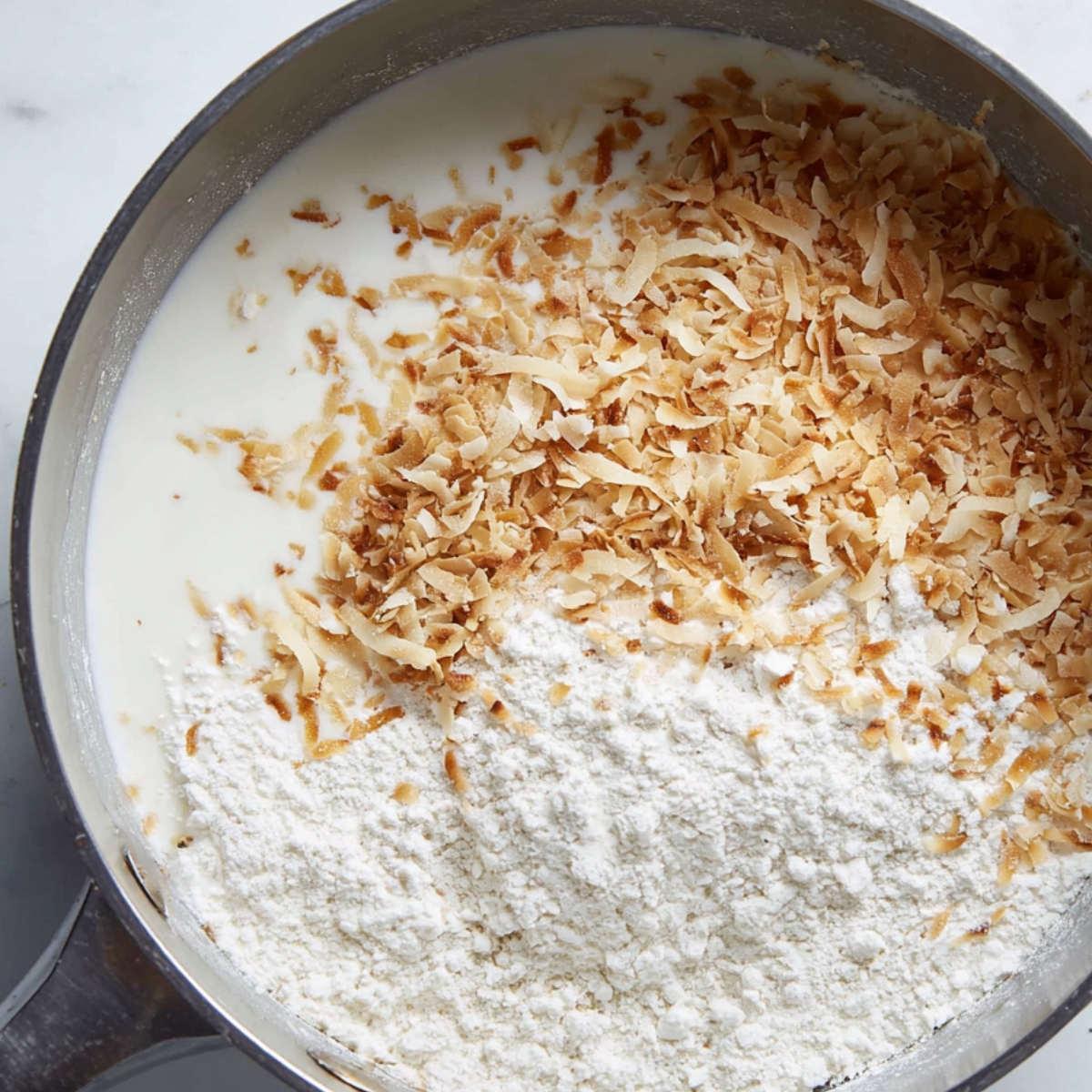 Making the coconut filling for these pie bars is a crucial step in creating that irresistible creamy texture. In a saucepan, a combination of milk, toasted coconut, and flour is carefully heated and mixed until it thickens into a velvety custard-like consistency. The coconut flakes blend seamlessly into the filling, infusing it with their rich, tropical flavor. Once the filling has cooled and set, it is spread over the graham cracker crust to form the foundation of the coconut cream pie bars. This rich, creamy layer is what sets these bars apart and gives them their signature taste that will have everyone asking for the recipe.