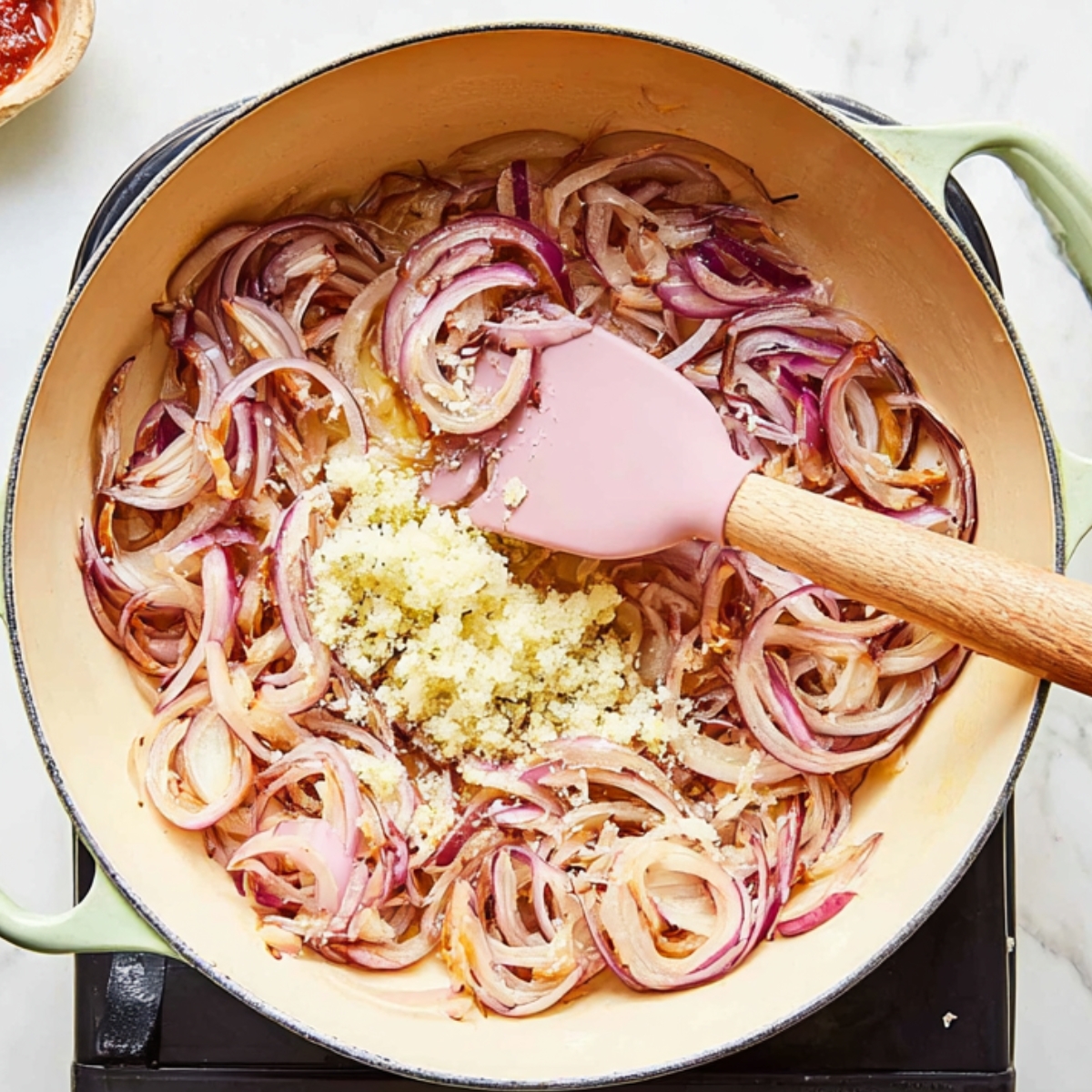 Sautéed red onions and garlic building the rich, savory base of the dish.