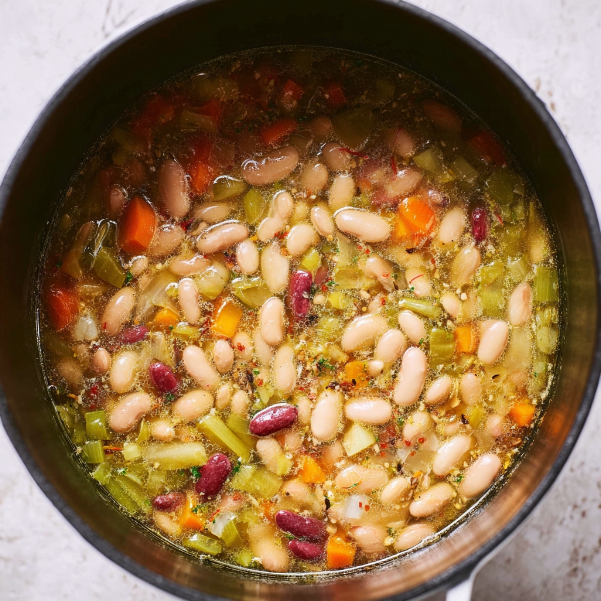 Simmering away! This 15-bean soup is packed with flavors and nutrients. ๐ฒ Perfect for a cozy dinner! #HealthySoup #BeanSoup #ComfortFood