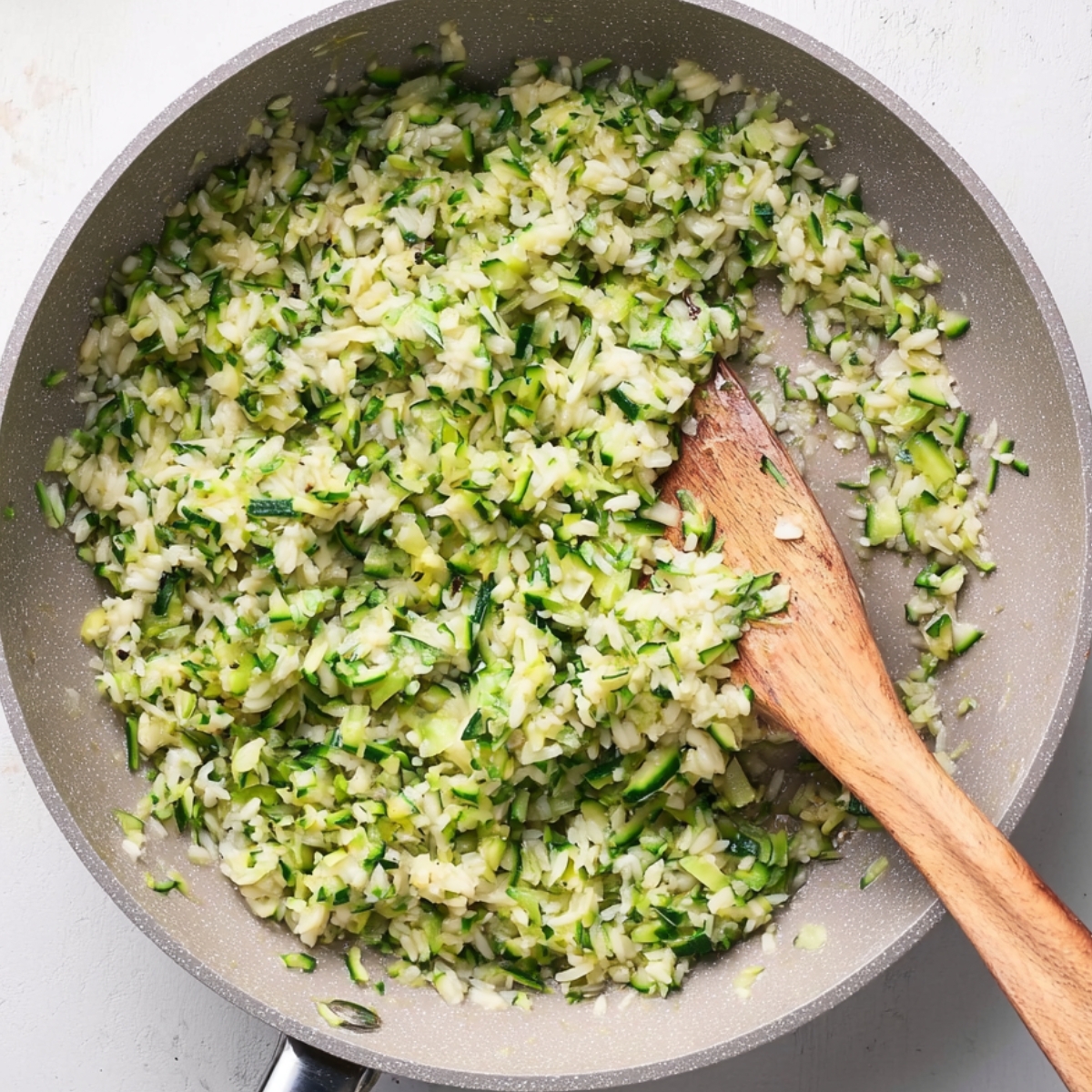 Zucchini Risotto in Progress – Stirring Fresh Shredded Zucchini with Arborio Rice