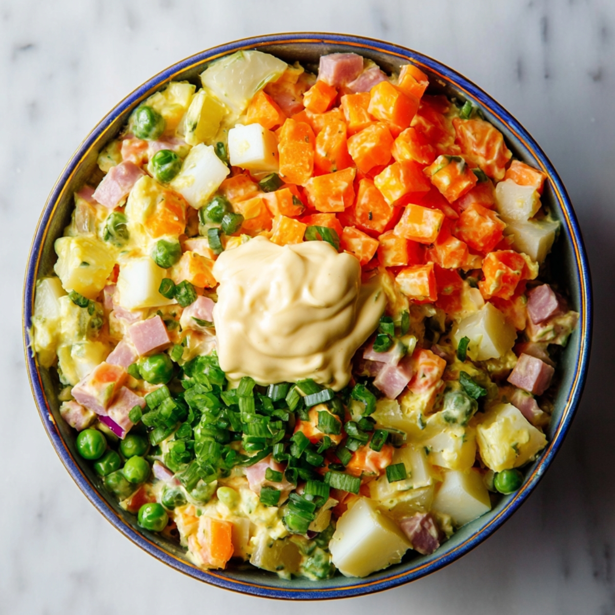 Close up of a colorful bowl of Russian Olivier salad with diced carrots, potatoes, peas, pickles, ham, chopped boiled eggs, green onions, and a dollop of mayonnaise, top-down view on a marble countertop, bright natural lighting, high detail, vibrant colors, food photography style